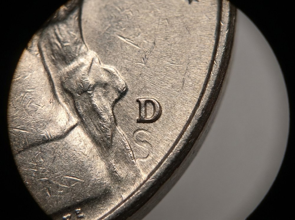Magnified view of a repunched D over S mintmark on a Jefferson nickel reverse
